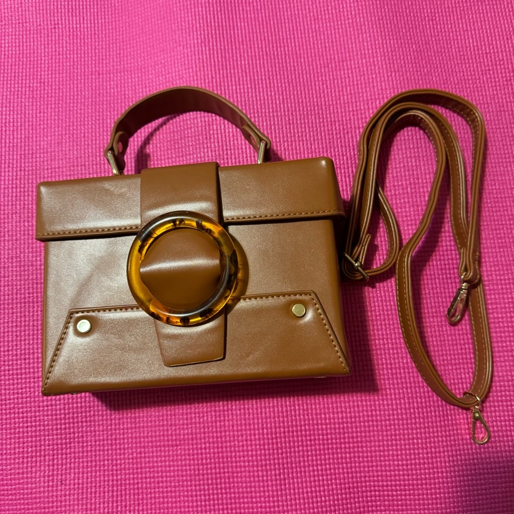 Brown Handbag with Gold Accent and Leopard Print Ring